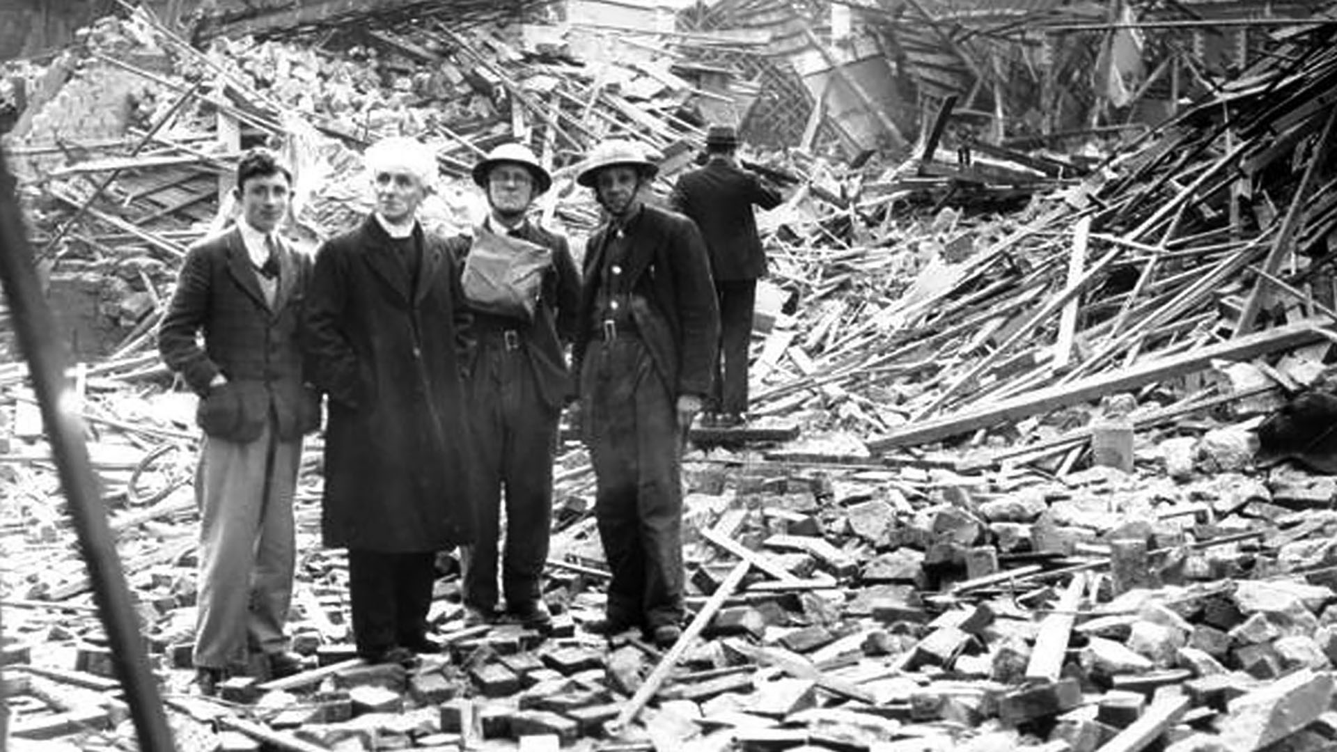 Reverend M.A. Thompson surveys the damage on Thorndyke Street, Belfast