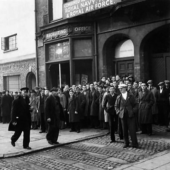 People of Belfast queue outside the Central Recruiting Office to enlist in the military following the Belfast Blitz
