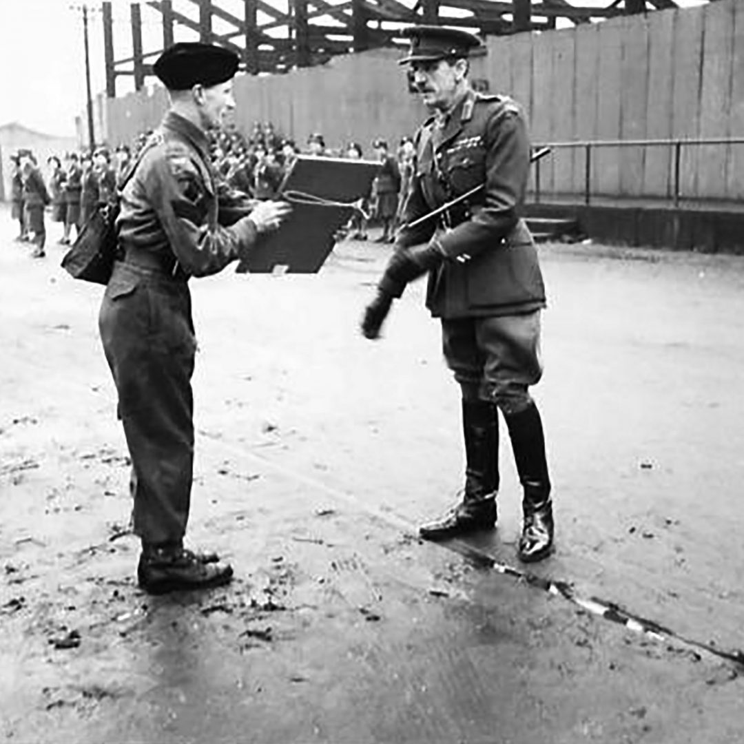 Lance Sergeant Lisle C. Chute of 31st Battalion Royal Ulster Rifles receives a certificate for bravery shown during the Belfast Blitz